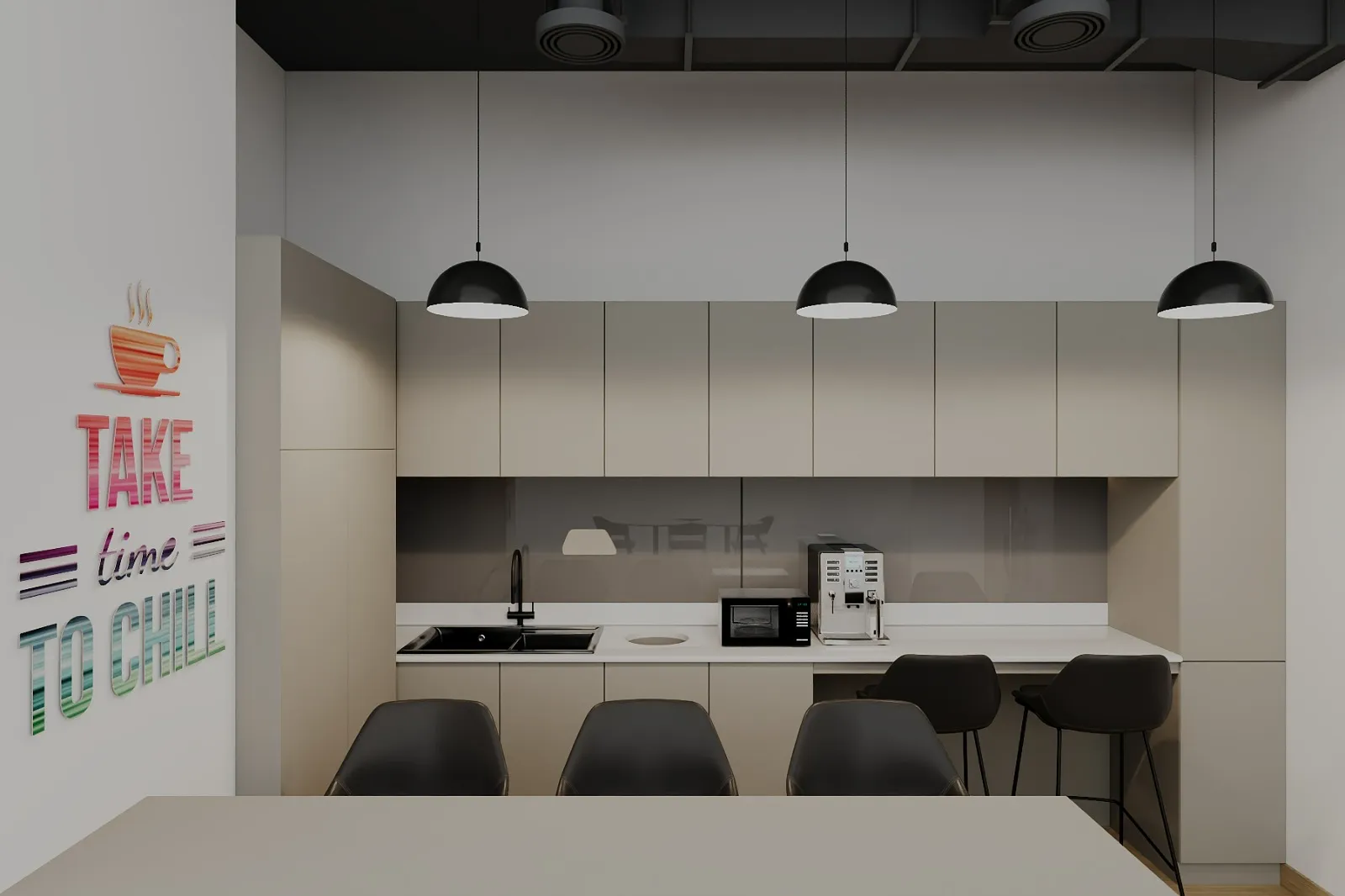 Modern office kitchenette with neutral cabinetry, black pendant lights, and a “Take time to chill” wall graphic.
